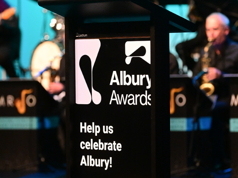 Lectern with a sign saying Albury Awards