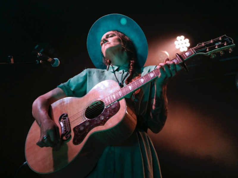 Musician Kerryn Fields with her guitar